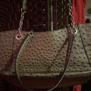 Beautiful medium size bag w/ small tear on inside pocket.